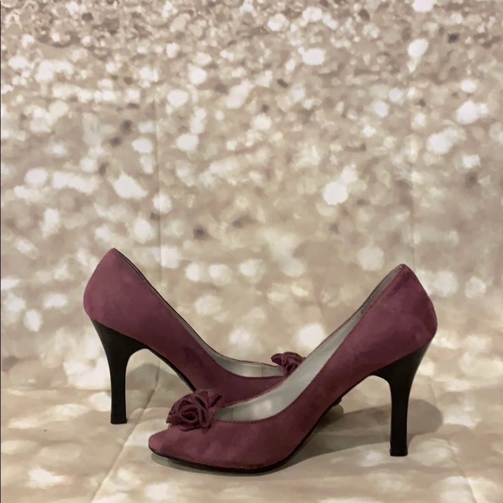 Purple size 7 Fioni pumps. Good condition.